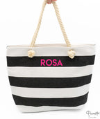 Bolso marinero de lona a rayas blancas y negras con asas de cuerda y nombre personalizado.