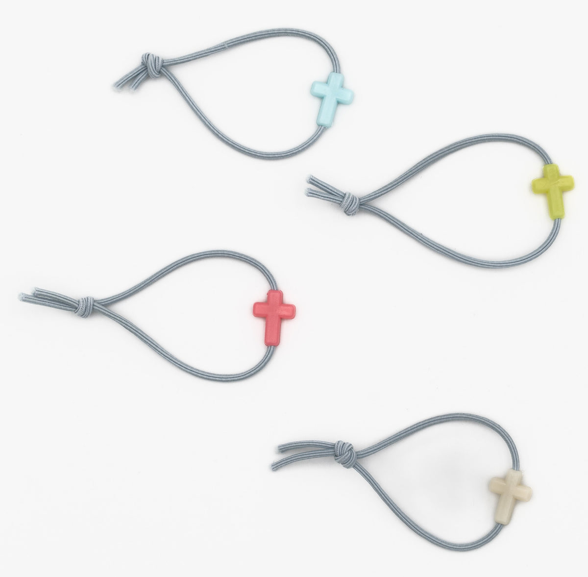 Quattro braccialetti grigi per bambini con perline in silicone a forma di croce in vari colori