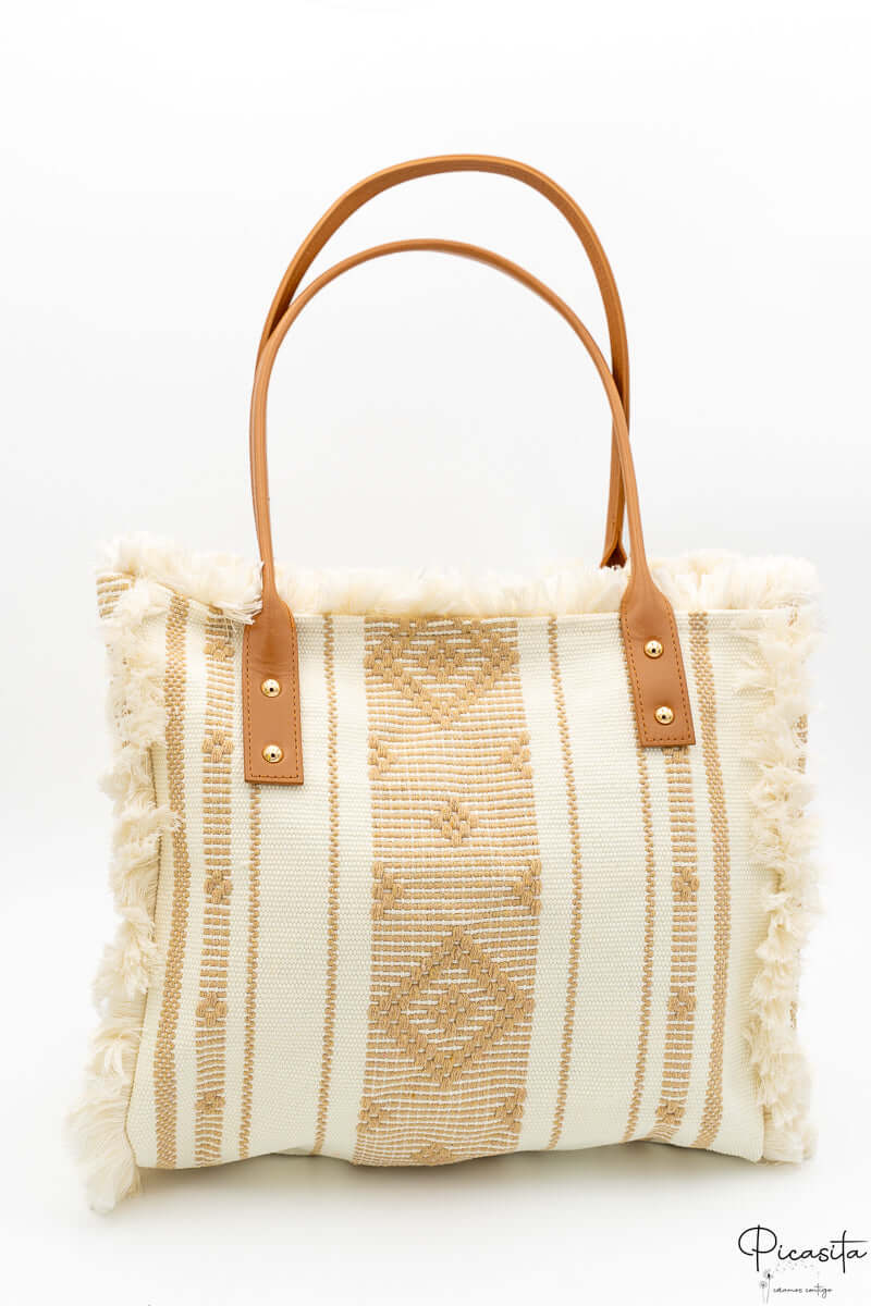 Bolso de tela a rayas beige con flecos laterales y asas de cuero PU marrón.