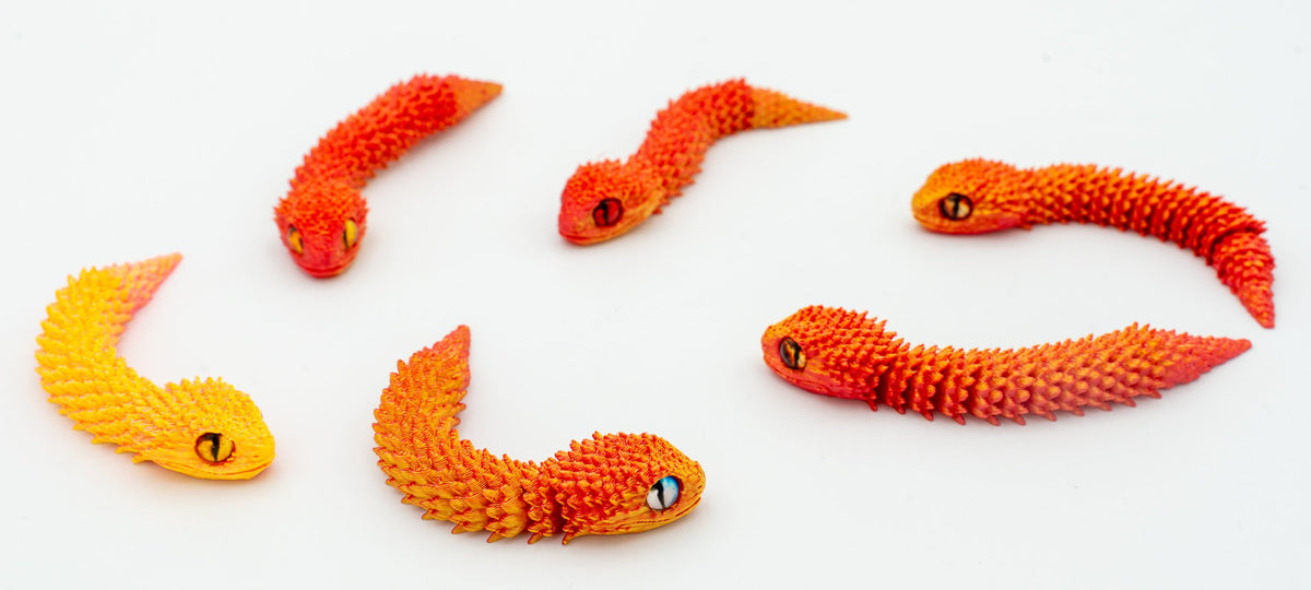 Serpenti 3D articolati con sfumatura arancione e gialla