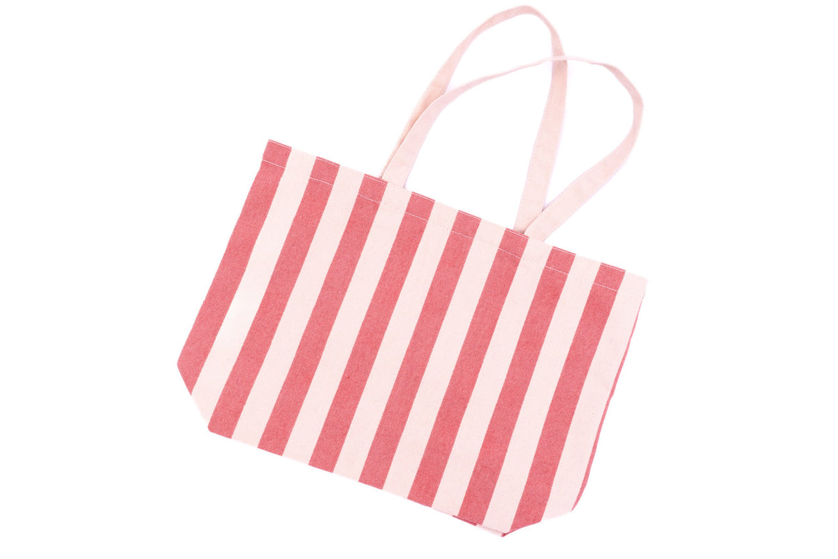 Vista d’insieme di una borsa da spiaggia in cotone a righe rosa e bianche